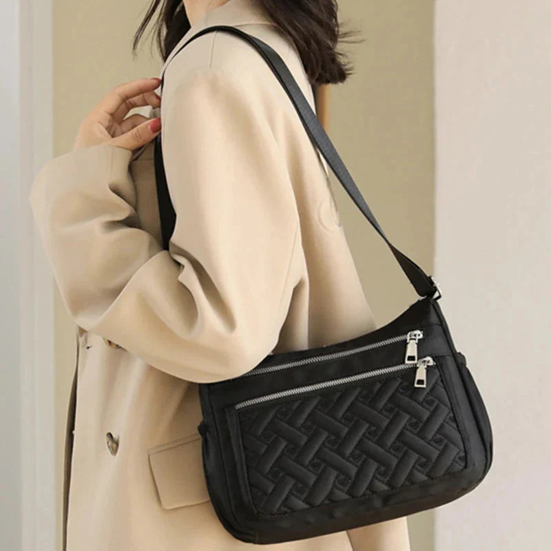 Aranya™ | Nylon skulderveske med budbringer